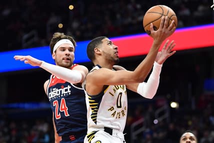 Feb 11, 2023; Washington, District of Columbia, USA; Indiana Pacers guard Tyrese Haliburton (0) shoots as Washington Wizards forward Corey Kispert (24) defends during the first half at Capital One Arena. Mandatory Credit: Brad Mills-USA TODAY Sports