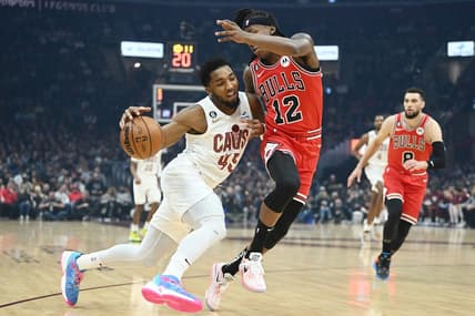 Feb 11, 2023; Cleveland, Ohio, USA; Cleveland Cavaliers guard Donovan Mitchell (45) drives to the basket against Chicago Bulls guard Ayo Dosunmu (12) during the first half at Rocket Mortgage FieldHouse. Mandatory Credit: Ken Blaze-USA TODAY Sports