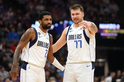 Feb 11, 2023; Sacramento, California, USA; Dallas Mavericks guard Kyrie Irving (2) and guard Luka Doncic (77) talk during the first quarter against the Sacramento Kings at Golden 1 Center. Mandatory Credit: Darren Yamashita-USA TODAY Sports