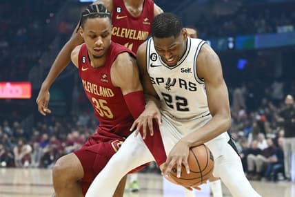 Feb 13, 2023; Cleveland, Ohio, USA; Cleveland Cavaliers forward Isaac Okoro (35) and San Antonio Spurs guard Malaki Branham (22) fight for the ball during the first half at Rocket Mortgage FieldHouse. Mandatory Credit: Ken Blaze-USA TODAY Sports
