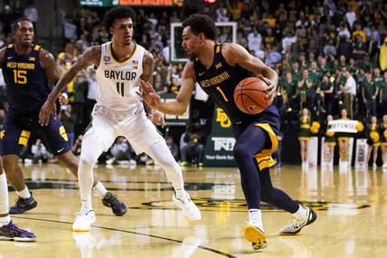 Feb 13, 2023; Waco, Texas, USA; West Virginia Mountaineers forward Emmitt Matthews Jr. (1) works past Baylor Bears forward Jalen Bridges (11) during the first half at Ferrell Center. Mandatory Credit: Raymond Carlin III-USA TODAY Sports