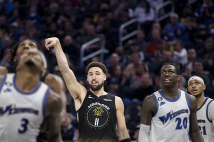Feb 13, 2023; San Francisco, California, USA; Golden State Warriors guard Klay Thompson (11) watches his shot drop against the Washington Wizards during the first half at Chase Center. Mandatory Credit: John Hefti-USA TODAY Sports