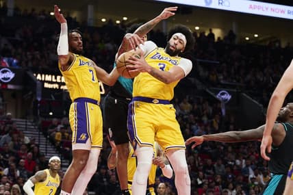 Feb 13, 2023; Portland, Oregon, USA; Los Angeles Lakers forward Anthony Davis (3) grabs a rebound during the second half against Portland Trail Blazers guard Anfernee Simons (1) at Moda Center. Mandatory Credit: Troy Wayrynen-USA TODAY Sports