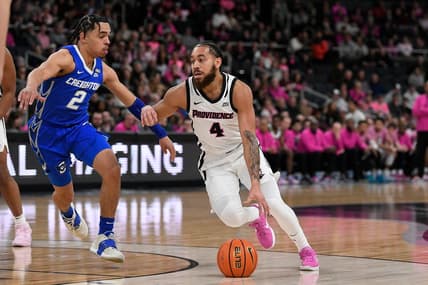 Feb 14, 2023; Providence, Rhode Island, USA; Providence Friars guard Jared Bynum (4) works to drive by Creighton Bluejays guard Ryan Nembhard (2) during the first half at Amica Mutual Pavilion. Mandatory Credit: Eric Canha-USA TODAY Sports