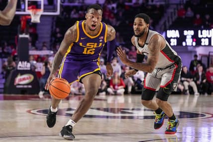 Feb 14, 2023; Athens, Georgia, USA; LSU Tigers forward KJ Williams (12) dribbles to the basket past Georgia Bulldogs forward Jailyn Ingram (15) during the first half at Stegeman Coliseum. Mandatory Credit: Dale Zanine-USA TODAY Sports