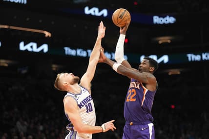 Feb 14, 2023; Phoenix, Arizona, USA; Phoenix Suns center Deandre Ayton (22) shoots over Sacramento Kings forward Domantas Sabonis (10) during the first half at Footprint Center. Mandatory Credit: Joe Camporeale-USA TODAY Sports