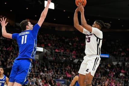Feb 14, 2023; Providence, Rhode Island, USA; Providence Friars forward Bryce Hopkins (23) shoots over Creighton Bluejays center Ryan Kalkbrenner (11) during the first half at Amica Mutual Pavilion. Mandatory Credit: Eric Canha-USA TODAY Sports