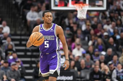 Feb 11, 2023; Sacramento, California, USA; Sacramento Kings guard De'Aaron Fox (5) dribbles against the Dallas Mavericks during the fourth quarter at Golden 1 Center. Mandatory Credit: Darren Yamashita-USA TODAY Sports