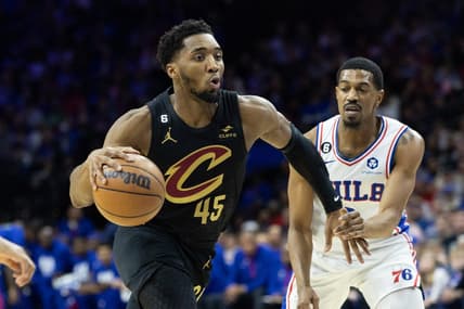 Feb 15, 2023; Philadelphia, Pennsylvania, USA; Cleveland Cavaliers guard Donovan Mitchell (45) drives past Philadelphia 76ers guard De'Anthony Melton (8) during the first quarter at Wells Fargo Center. Mandatory Credit: Bill Streicher-USA TODAY Sports