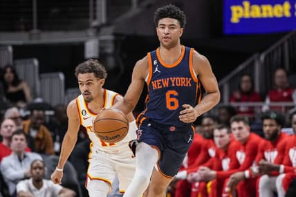 Feb 15, 2023; Atlanta, Georgia, USA; New York Knicks guard Quentin Grimes (6) dribblers past Atlanta Hawks guard Trae Young (11) during the first half at State Farm Arena. Mandatory Credit: Dale Zanine-USA TODAY Sports