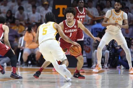 Feb 15, 2023; Knoxville, Tennessee, USA; Alabama Crimson Tide guard Mark Sears (1) defends Tennessee Volunteers guard Zakai Zeigler (5) at Thompson-Boling Arena. Mandatory Credit: Randy Sartin-USA TODAY Sports