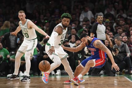 Feb 15, 2023; Boston, Massachusetts, USA; Boston Celtics guard Marcus Smart (36) steals the ball from Detroit Pistons guard Cory Joseph (18) during the first half at TD Garden. Mandatory Credit: Bob DeChiara-USA TODAY Sports