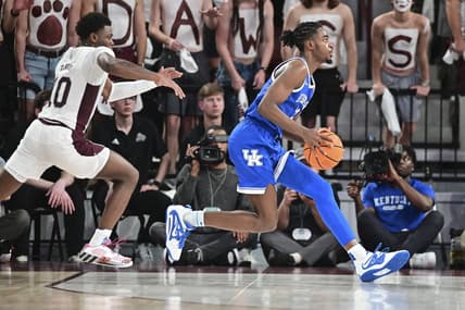 Feb 15, 2023; Starkville, Mississippi, USA; Kentucky Wildcats guard Antonio Reeves (12) handles the ball while defended by Mississippi State Bulldogs guard Dashawn Davis (10) during the first half at Humphrey Coliseum. Mandatory Credit: Matt Bush-USA TODAY Sports
