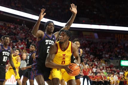 Feb 15, 2023; Ames, Iowa, USA; TCU Horned Frogs forward Emanuel Miller (2) loclkls down Iowa State Cyclones forward Tre King (0) during the first half at James H. Hilton Coliseum. Mandatory Credit: Reese Strickland-USA TODAY Sports