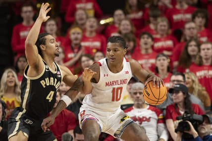 Feb 16, 2023; College Park, Maryland, USA;  Maryland Terrapins forward Julian Reese (10) dribbles as Purdue Boilermakers forward Trey Kaufman-Renn (4) defends during the first half at Xfinity Center. Mandatory Credit: Tommy Gilligan-USA TODAY Sports