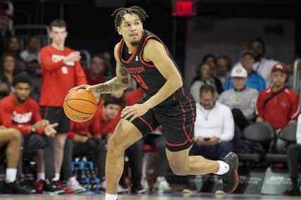 Feb 16, 2023; Dallas, Texas, USA; Houston Cougars guard Emanuel Sharp (21) pushes the ball up court against the Southern Methodist Mustangs during the first half at Moody Coliseum. Mandatory Credit: Raymond Carlin III-USA TODAY Sports