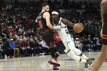 Feb 16, 2023; Chicago, Illinois, USA;  Milwaukee Bucks guard Jrue Holiday (21) drives to the basket against Chicago Bulls guard Zach LaVine (8) during the first half at the United Center. Mandatory Credit: Matt Marton-USA TODAY Sports