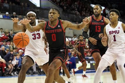 Feb 16, 2023; Dallas, Texas, USA; Houston Cougars guard Marcus Sasser (0) and Southern Methodist Mustangs forward Franklin Agunanne (33) reach for the loose ball during the second half at Moody Coliseum. Mandatory Credit: Raymond Carlin III-USA TODAY Sports