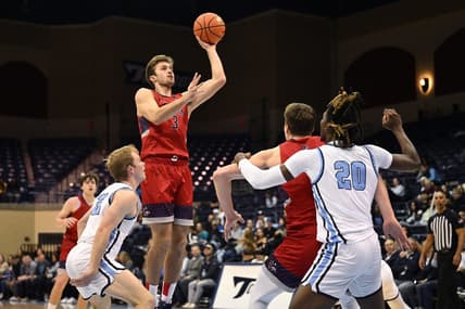 Feb 16, 2023; San Diego, California, USA; Saint Mary's Gaels guard Augustas Marciulionis (3) shoots the ball over San Diego Toreros guard Dominic Muncey (32) during the first half at Jenny Craig Pavilion. Mandatory Credit: Orlando Ramirez-USA TODAY Sports