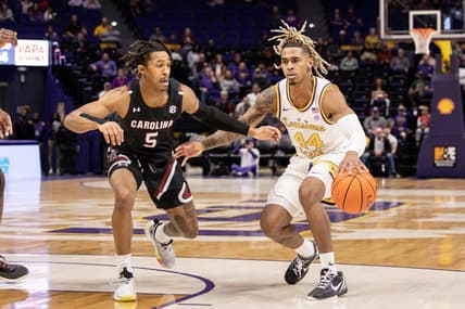 Feb 18, 2023; Baton Rouge, Louisiana, USA; LSU Tigers guard Adam Miller (44) dribbles against South Carolina Gamecocks guard Meechie Johnson (5) at Pete Maravich Assembly Center. Mandatory Credit: Stephen Lew-USA TODAY Sports