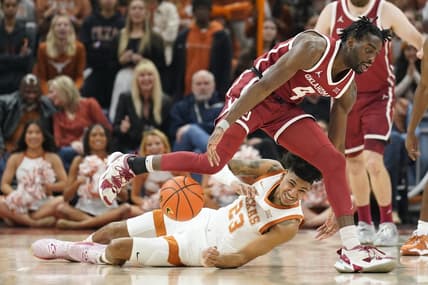 Feb 18, 2023; Austin, Texas, USA; Texas Longhorns forward Dillon Mitchell (23) and Oklahoma Sooners guard Joe Bamisile (4) battle for the loose ball during the first at Moody Center. Mandatory Credit: Scott Wachter-USA TODAY Sports