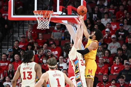Feb 19, 2023; Lincoln, Nebraska, USA; Maryland Terrapins forward Patrick Emilien (15) attempts a shot over Nebraska Cornhuskers forward Wilhelm Breidenbach (32) in the first half at Pinnacle Bank Arena. Mandatory Credit: Steven Branscombe-USA TODAY Sports