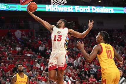 Feb 19, 2023; Lincoln, Nebraska, USA; Nebraska Cornhuskers forward Derrick Walker (13) reaches for a loose ball against Maryland Terrapins forward Julian Reese (10) in the first half at Pinnacle Bank Arena. Mandatory Credit: Steven Branscombe-USA TODAY Sports