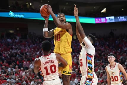 Feb 19, 2023; Lincoln, Nebraska, USA;  Maryland Terrapins forward Julian Reese (10) attempt a shot against Nebraska Cornhuskers guard Jamarques Lawrence (10) and forward Blaise Keita (15) in the second half at Pinnacle Bank Arena. Mandatory Credit: Steven Branscombe-USA TODAY Sports