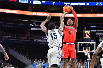 Feb 22, 2023; Washington, District of Columbia, USA; St. John's Red Storm guard AJ Storr (2) shoots over Georgetown Hoyas forward Bryson Mozone (15) during the first half at Capital One Arena. Mandatory Credit: Brad Mills-USA TODAY Sports