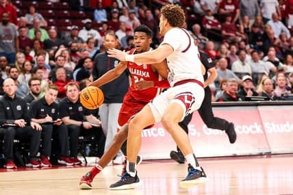 Feb 22, 2023; Columbia, South Carolina, USA; Alabama Crimson Tide forward Brandon Miller (24) drives around South Carolina Gamecocks forward Benjamin Bosmans-Verdonk (31) in the first half at Colonial Life Arena. Mandatory Credit: Jeff Blake-USA TODAY Sports