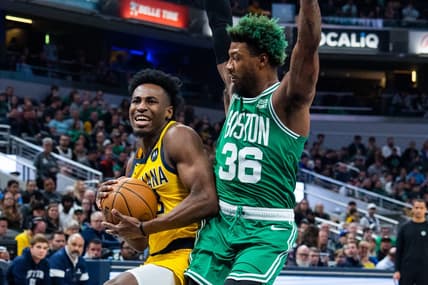Feb 23, 2023; Indianapolis, Indiana, USA; Indiana Pacers forward Aaron Nesmith (23) shoots the ball while Boston Celtics guard Marcus Smart (36) defends in the first quarter at Gainbridge Fieldhouse. Mandatory Credit: Trevor Ruszkowski-USA TODAY Sports