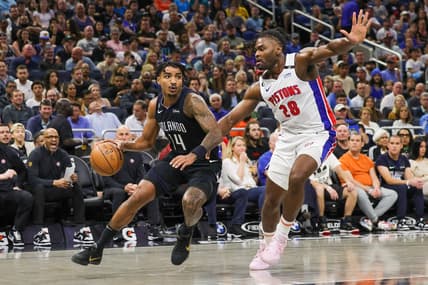 Feb 23, 2023; Orlando, Florida, USA; Orlando Magic guard Gary Harris (14) drives around Detroit Pistons center Isaiah Stewart (28) during the first quarter at Amway Center. Mandatory Credit: Mike Watters-USA TODAY Sports
