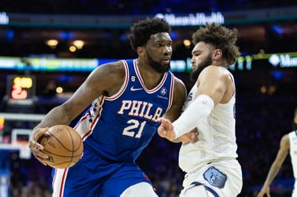 Feb 23, 2023; Philadelphia, Pennsylvania, USA; Philadelphia 76ers center Joel Embiid (21) drives against Memphis Grizzlies forward David Roddy (27) during the second quarter at Wells Fargo Center. Mandatory Credit: Bill Streicher-USA TODAY Sports