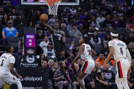 Feb 23, 2023; Sacramento, California, USA; Sacramento Kings guard Terence Davis (3) drives to the basket against Portland Trail Blazers forward Jabari Walker (34) during the second quarter at Golden 1 Center. Mandatory Credit: Sergio Estrada-USA TODAY Sports