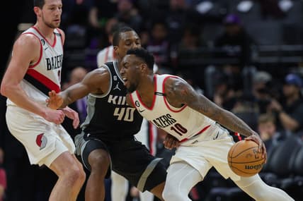 Feb 23, 2023; Sacramento, California, USA; Portland Trail Blazers forward Nassir Little (10) dribbles the ball against Sacramento Kings forward Harrison Barnes (40) during the third quarter at Golden 1 Center. Mandatory Credit: Sergio Estrada-USA TODAY Sports