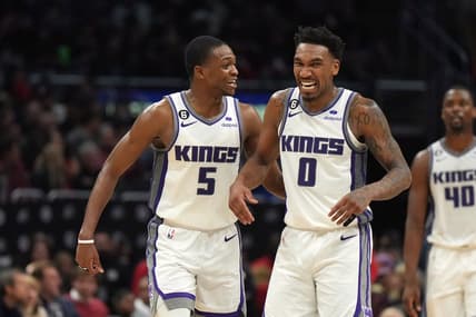 Feb 24, 2023; Los Angeles, California, USA; Sacramento Kings guard De'Aaron Fox (5) and guard Malik Monk (0) celebrate against the LA Clippers in the second half at Crypto.com Arena. The Kings defeated the Clippers 176-175 in double overtime. Mandatory Credit: Kirby Lee-USA TODAY Sports
