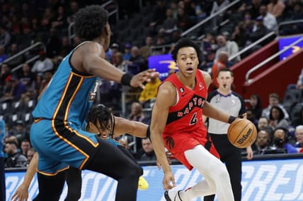 Feb 25, 2023; Detroit, Michigan, USA; Toronto Raptors forward Scottie Barnes (4) dribbles on Detroit Pistons center James Wiseman (13) in the first half at Little Caesars Arena. Mandatory Credit: Rick Osentoski-USA TODAY Sports