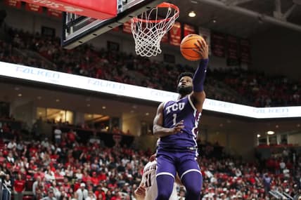 Feb 25, 2023; Lubbock, Texas, USA; TCU Horned Frogs guard Mike Miles Jr. (1) shoots the ball against Texas Tech Red Raiders forward Fardaws Aimaq (11) in the first half at United Supermarkets Arena. Mandatory Credit: Michael C. Johnson-USA TODAY Sports