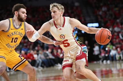 Feb 25, 2023; Lincoln, Nebraska, USA;  Nebraska Cornhuskers guard Sam Griesel (5) drives against Minnesota Golden Gophers forward Jamison Battle (10) in the first half at Pinnacle Bank Arena. Mandatory Credit: Steven Branscombe-USA TODAY Sports