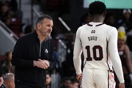 Feb 25, 2023; Starkville, Mississippi, USA; Mississippi State Bulldogs head coach Chris Jans (left) talks with guard Dashawn Davis (10) during the second half against the Texas A&M Aggies at Humphrey Coliseum. Mandatory Credit: Petre Thomas-USA TODAY Sports