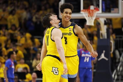 Feb 25, 2023; Milwaukee, Wisconsin, USA;  Marquette Golden Eagles forward Oso Ighodaro (13) celebrates with guard Tyler Kolek (11) following a made basket during the first half against the DePaul Blue Demons at Fiserv Forum. Mandatory Credit: Jeff Hanisch-USA TODAY Sports