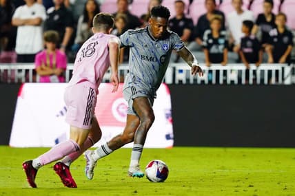 Feb 25, 2023; Fort Lauderdale, Florida, USA; CF Montreal forward Romell Quioto (30) dribbles the ball against Inter Miami CF defender Harvey James Neville (18) during the second half at DRV PNK Stadium. Mandatory Credit: John David Mercer-USA TODAY Sports