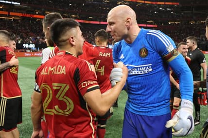Feb 25, 2023; Atlanta, Georgia, USA; Atlanta United FC midfielder Thiago Almada (23) celebrates with goalkeeper Brad Guzan (1) after the game against the San Jose Earthquakes at Mercedes-Benz Stadium. Mandatory Credit: Brett Davis-USA TODAY Sports