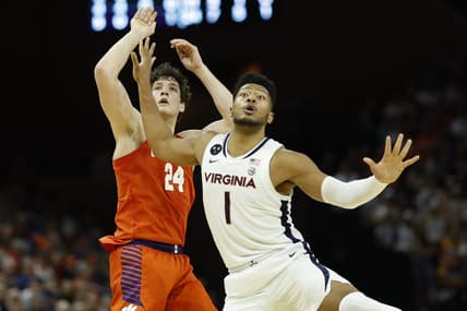 Feb 28, 2023; Charlottesville, Virginia, USA; Clemson Tigers center PJ Hall (24) and Virginia Cavaliers forward Jayden Gardner (1) follow Hall's shot in the first half at John Paul Jones Arena. Mandatory Credit: Geoff Burke-USA TODAY Sports