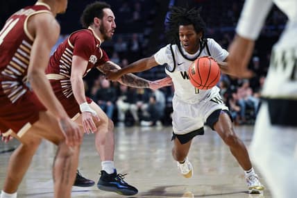 Feb 28, 2023; Winston-Salem, North Carolina, USA; Wake Forest Demon Deacons guard Tyree Appleby (1) drives past Boston College Eagles guard Jaeden Zackery (3) during the first half at Lawrence Joel Veterans Memorial Coliseum. Mandatory Credit: William Howard-USA TODAY Sports