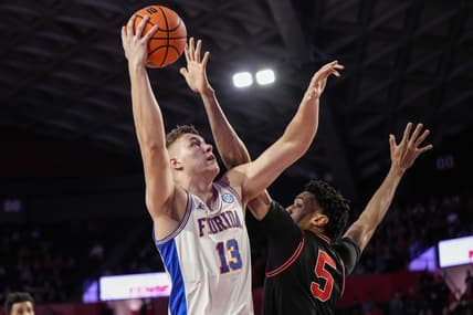 Feb 28, 2023; Athens, Georgia, USA; Florida Gators forward Aleks Szymczyk (13) shoots over Georgia Bulldogs center Frank Anselem (5) during the first half at Stegeman Coliseum. Mandatory Credit: Dale Zanine-USA TODAY Sports