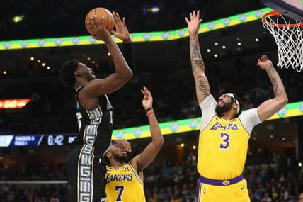 Feb 28, 2023; Memphis, Tennessee, USA; Memphis Grizzlies forward Jaren Jackson Jr. (13) shoots as Los Angeles Lakers forward Anthony Davis (3) defends during the first half at FedExForum. Mandatory Credit: Petre Thomas-USA TODAY Sports