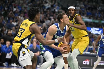 Feb 28, 2023; Dallas, Texas, USA; Dallas Mavericks center Dwight Powell (7) grabs a rebound between Indiana Pacers forward Aaron Nesmith (23) and center Myles Turner (33) during the first quarter at the American Airlines Center. Mandatory Credit: Jerome Miron-USA TODAY Sports