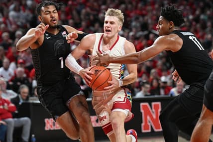 Feb 28, 2023; Lincoln, Nebraska, USA; Nebraska Cornhuskers guard Sam Griesel (5) drives between Michigan State Spartans guard Pierre Brooks (1) and guard A.J. Hoggard (11) in the first half at Pinnacle Bank Arena. Mandatory Credit: Steven Branscombe-USA TODAY Sports