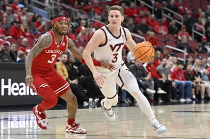 Feb 28, 2023; Louisville, Kentucky, USA; Virginia Tech Hokies guard Sean Pedulla (3) dribbles against Louisville Cardinals guard El Ellis (3) during the first half at KFC Yum! Center. Mandatory Credit: Jamie Rhodes-USA TODAY Sports